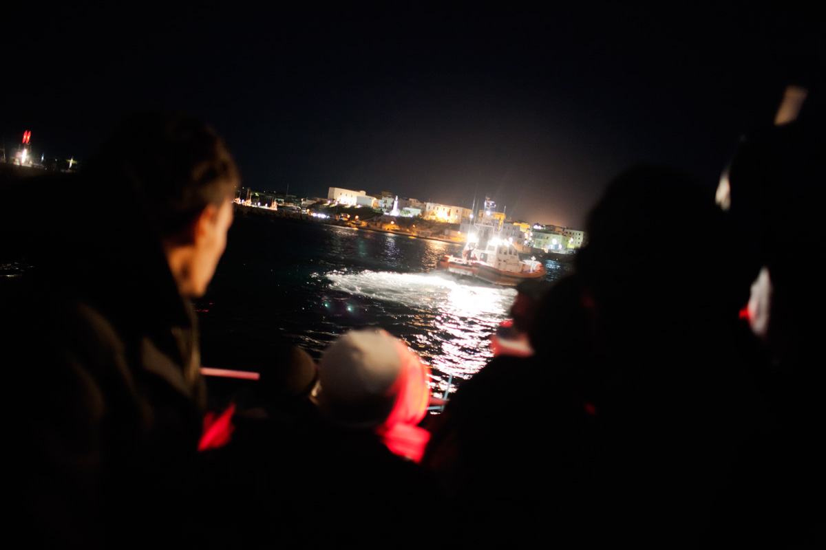 After a 20-hour crossing, escorted by Italian coastguard ships, the trawler enters the port of Lampedusa. 