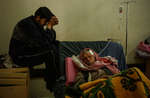 April 7th 2003.
 Wounded Iraqi civilians at the Al Kindi hospital.

